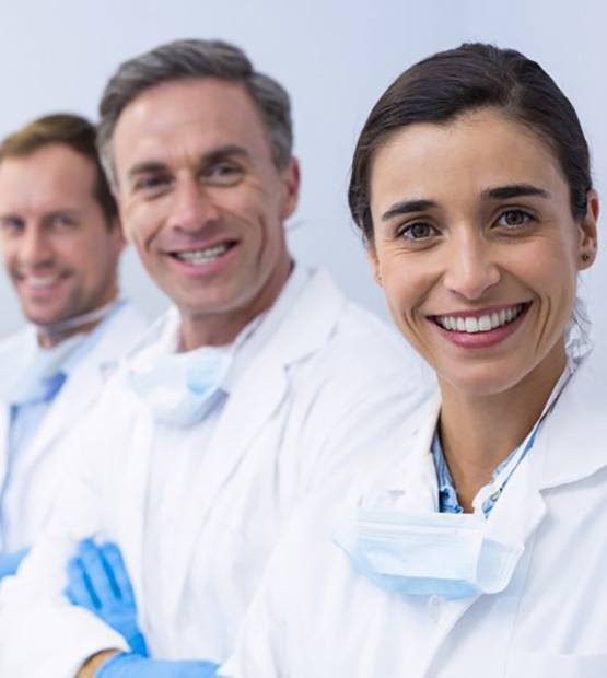 Dental staff members smiling