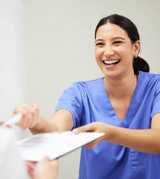 Dental staff member working with a patient
