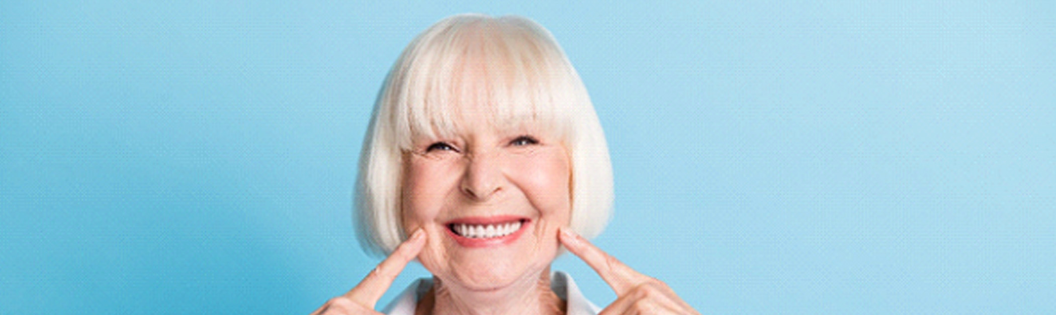 A woman after a full mouth reconstruction in Encino
