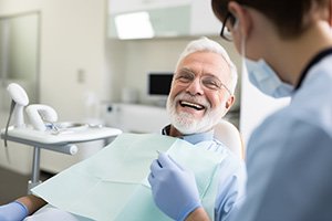 Older man smiling in the dentist’s chair