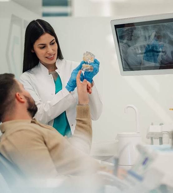 Male patient talking to his dentist