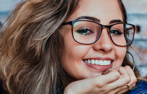 Woman in glasses smiling, encino ca
